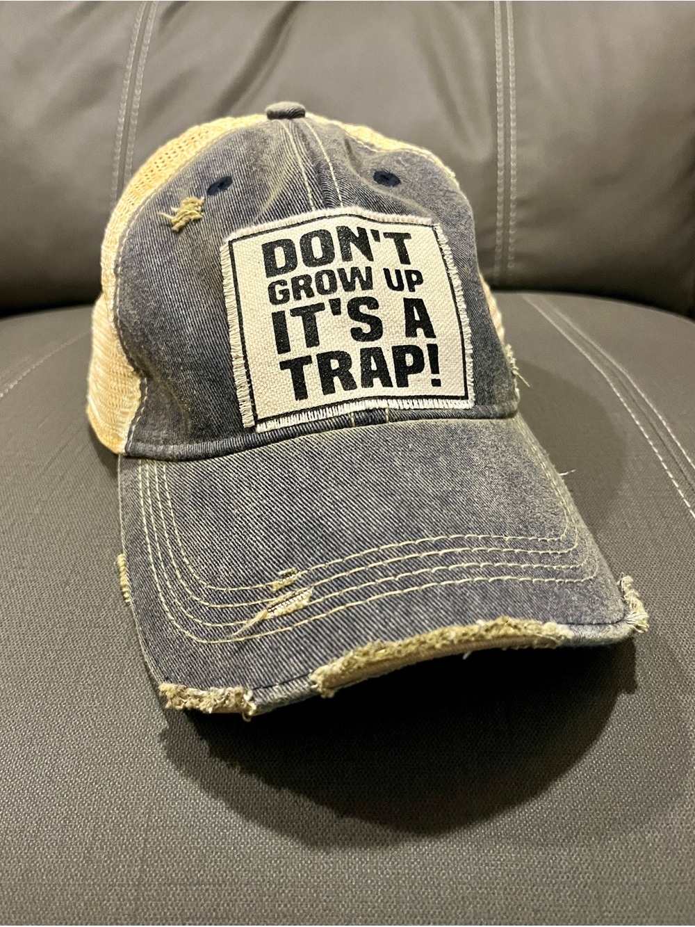 Distressed Denim Trucker Hat - "Don't Grow Up It's A Trap!" Patch